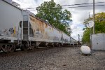 A southbound CSX freight clatters across the NS Diamonds 